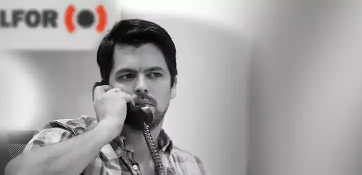 BELFOR employee on phone